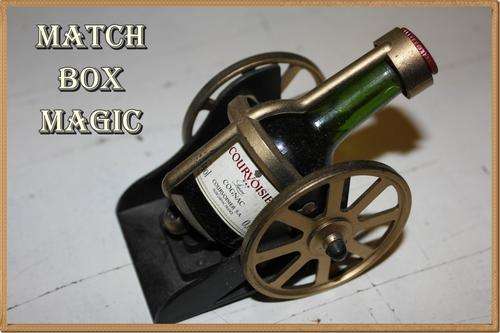 DINKY BOTTLE DESIGNED TO LOOK LIKE A CANNON COURVOISIER COGNAC FROM FRANCE