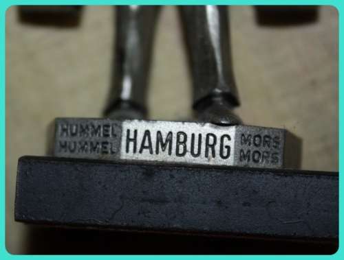 METAL STATUETTE MAN CARRYING BUCKETS HAMBURG ON BASE