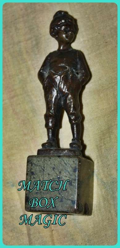 METAL STATUETTE BOY WITH HANDS IN POCKETS
