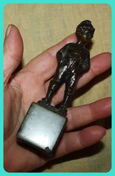 METAL STATUETTE BOY WITH HANDS IN POCKETS