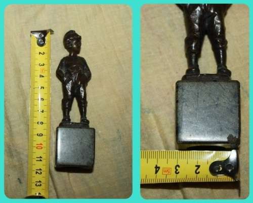 METAL STATUETTE BOY WITH HANDS IN POCKETS
