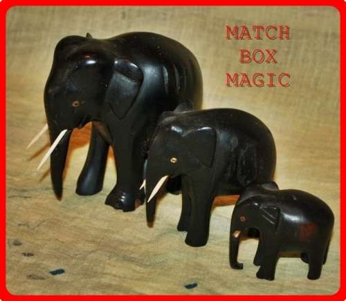 FAMILY OF THREE WOODEN ELEPHANTS