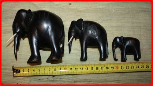 FAMILY OF THREE WOODEN ELEPHANTS