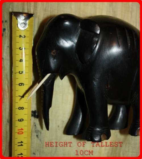 FAMILY OF THREE WOODEN ELEPHANTS