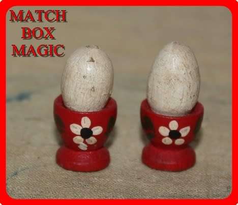 PAIR OF MINIATURE WOODEN HAND PAINTED EGGCUPS AND EGGS TO SWEET