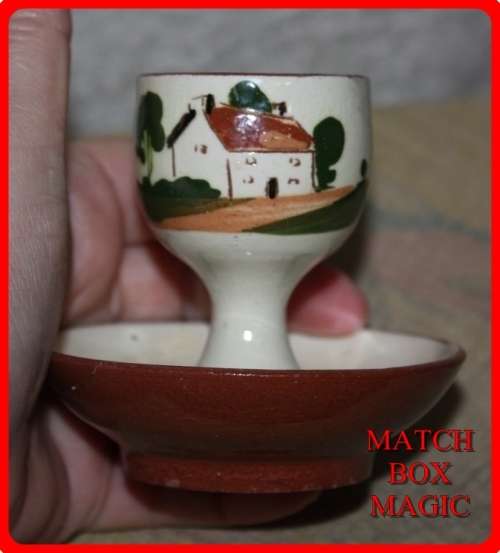 EGG CUP TORQUAY WARE  WATCOMBE  COTTAGE ON THE FRONT LAID TO DAY ON THE BACK FUN ITEM