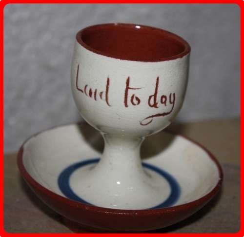 EGG CUP TORQUAY WARE  WATCOMBE  COTTAGE ON THE FRONT LAID TO DAY ON THE BACK FUN ITEM