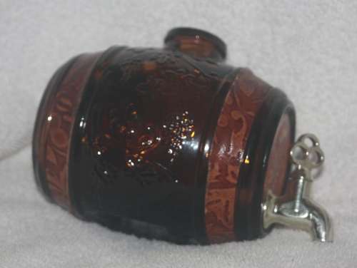 DECORATIVE AMBER GLASS BARREL WITH TAP HAS LEATHER INSERTS