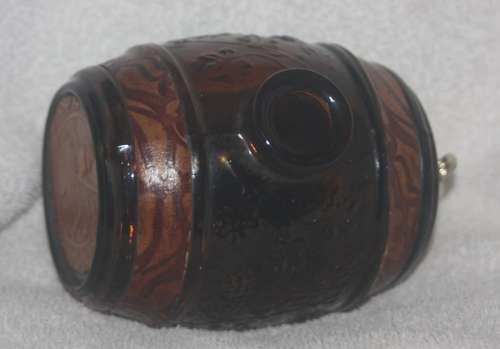 DECORATIVE AMBER GLASS BARREL WITH TAP HAS LEATHER INSERTS
