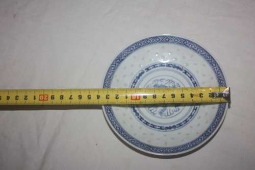 BLUE AND WHT CUP AND SAUCER ORIENTAL DESIGN WITH DRAGON MOTIEF