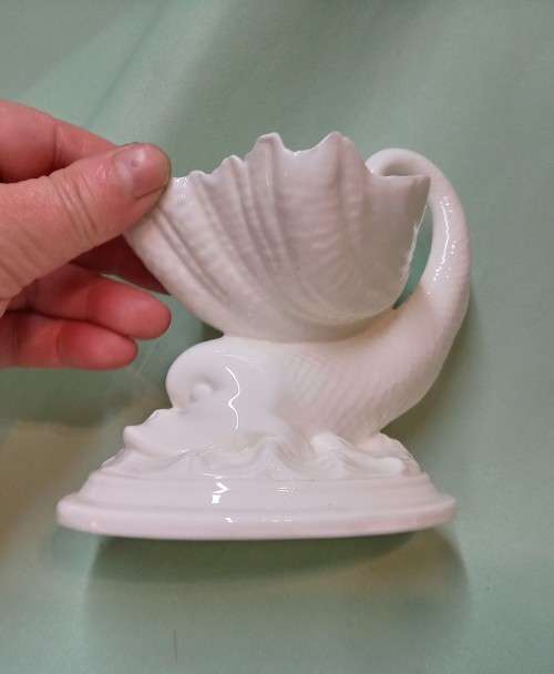 Royal Wocester dolphin supporting a clam shell ornament