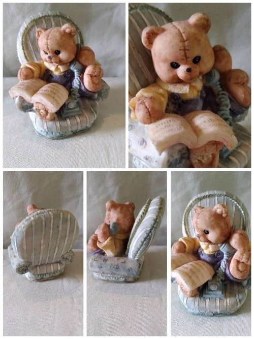 Teddy bear in blue armchair talking on the telephone