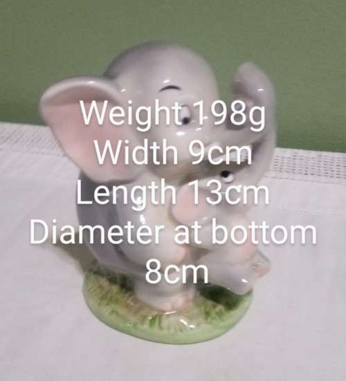 Money box porcelain elephant mom and baby vintage made in Japan. Label attached. Stopper in tact.