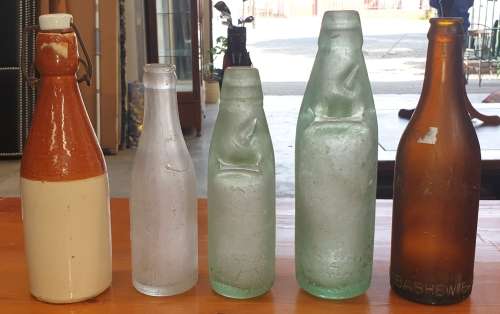 COLLECTION OF FIVE VINTAGE BOTTLE'S