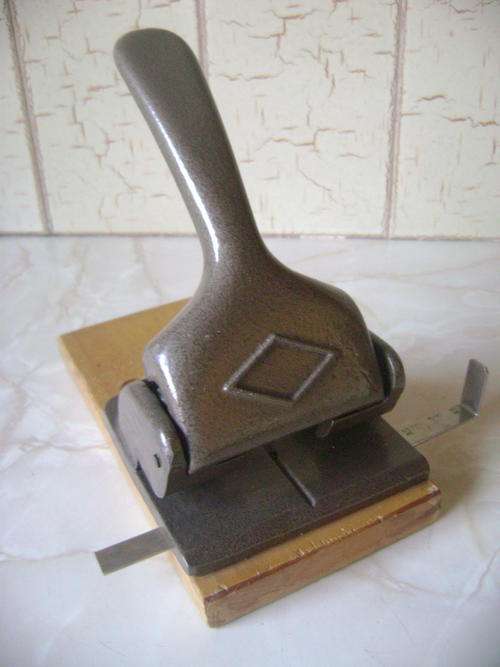 VINTAGE HEAVY PAPER PUNCH ON WOODEN BASE