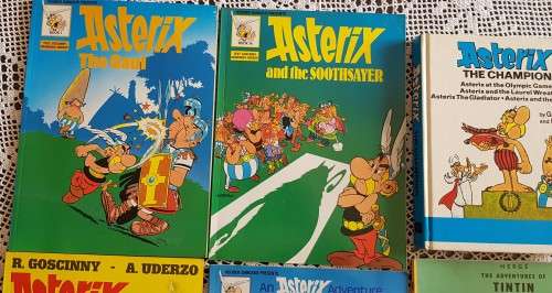 Comic books (5x Asterix plus 1x Tintin)
