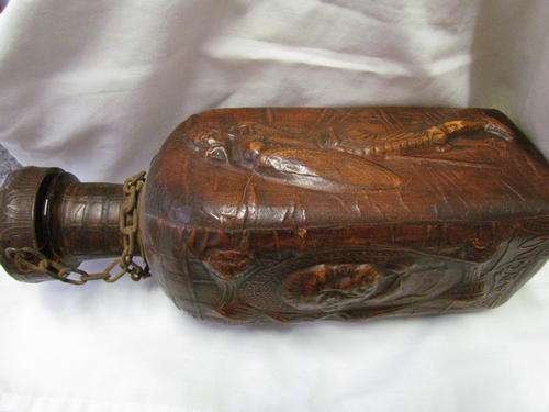A LEATHER WRAPPED DECANTER FROM THE 1960 - 1970 ERA!!
