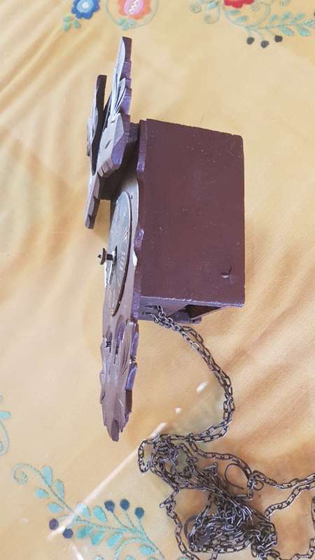 Small black forest clock ticking