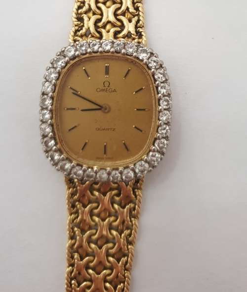 18K Gold Ladies Omega Watch.