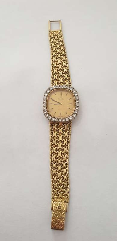 18K Gold Ladies Omega Watch.