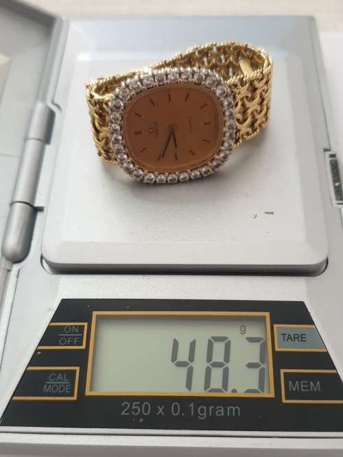 18K Gold Ladies Omega Watch.