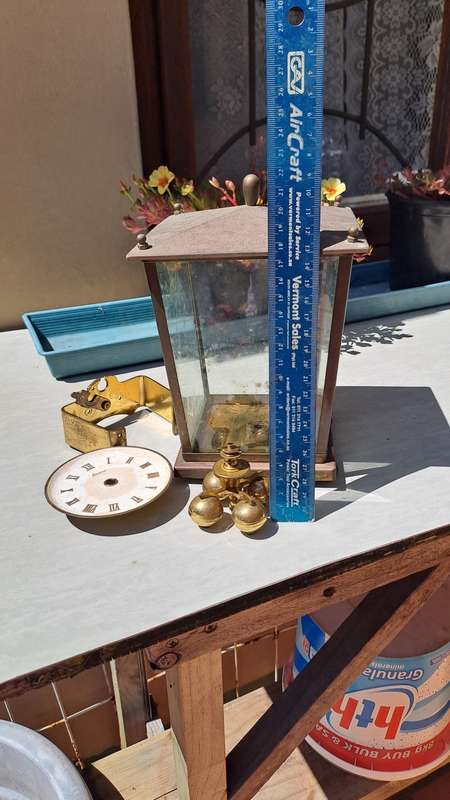 Brass clock housing with extras