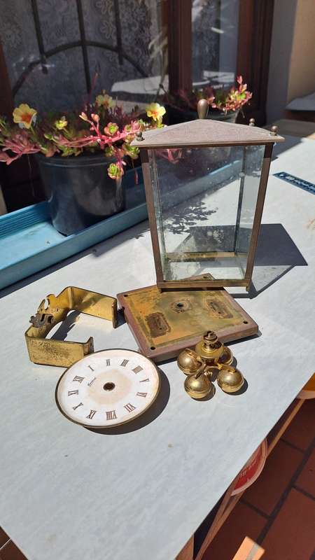 Brass clock housing with extras