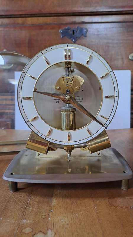 A Junghans Ato Brass And Glass Anticlimatic Electronic Clock