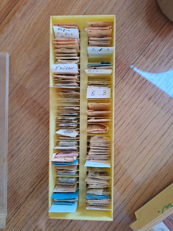 box of sorted and originally packed new vintage watch winding stems neatly sorted