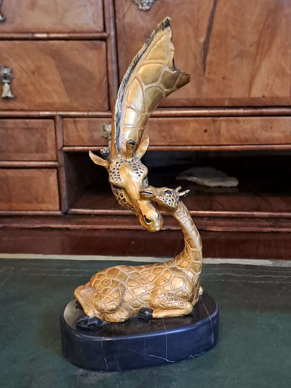 Beautiful bronze Giraffe mom and calf