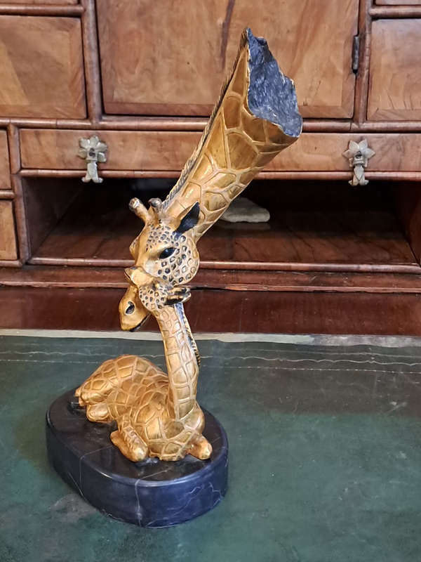 Beautiful bronze Giraffe mom and calf
