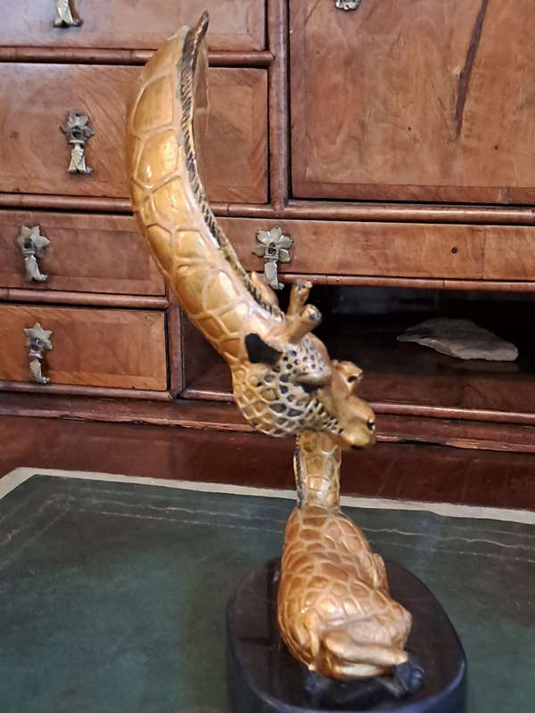 Beautiful bronze Giraffe mom and calf