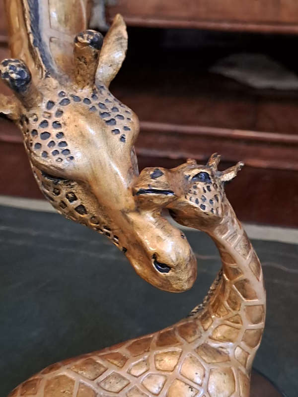 Beautiful bronze Giraffe mom and calf