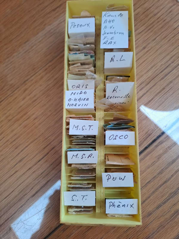 box of sorted and originally packed new vintage watch winding stems neatly sorted