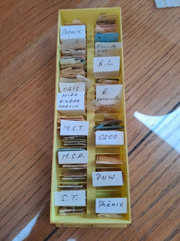 box of sorted and originally packed new vintage watch winding stems neatly sorted