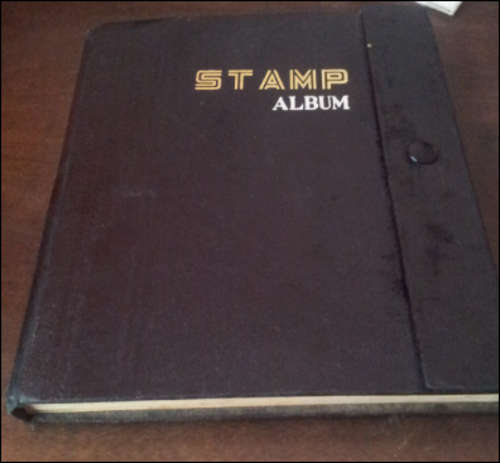 ***BLACK STAMP ALBUM FILLED WITH WORLD STAMPS @ BARGAIN PRICE***