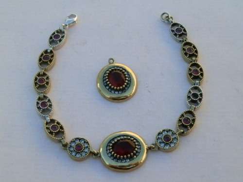 Sterling silver ruby pendant and bracelet combo, 23.4 g.