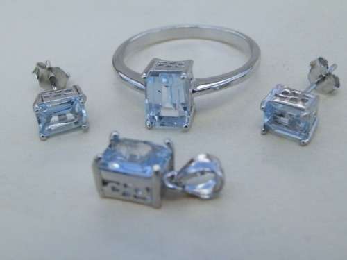 Elegant sterling silver blue topaz jewelry set - weight 4.4 g.  Thirty (30) days to pay