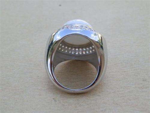 Spectacular heavy solid sterling silver topaz ring with white oval stone - weight 14.32 g.