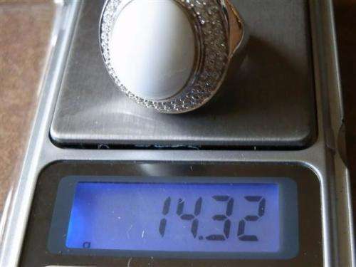 Spectacular heavy solid sterling silver topaz ring with white oval stone - weight 14.32 g.
