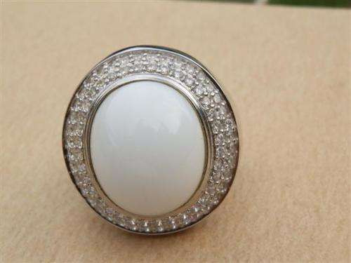 Spectacular heavy solid sterling silver topaz ring with white oval stone - weight 14.32 g.
