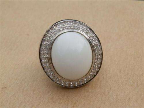 Spectacular heavy solid sterling silver topaz ring with white oval stone - weight 14.32 g.