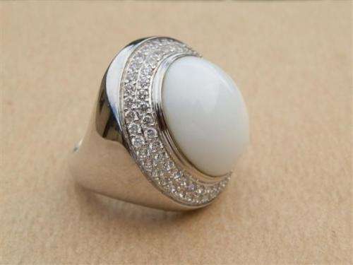 Spectacular heavy solid sterling silver topaz ring with white oval stone - weight 14.32 g.