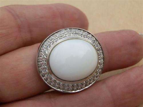 Spectacular heavy solid sterling silver topaz ring with white oval stone - weight 14.32 g.