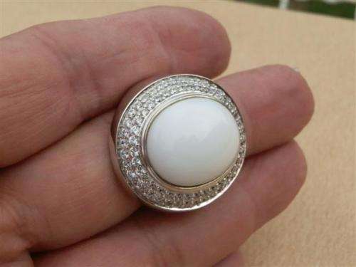 Spectacular heavy solid sterling silver topaz ring with white oval stone - weight 14.32 g.