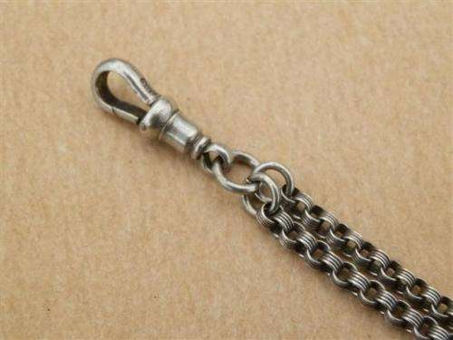Antique lady's Albert fob chain with pocket watch and fob seal.