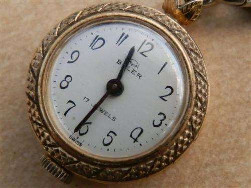 Antique lady's Albert fob chain with pocket watch and fob seal.