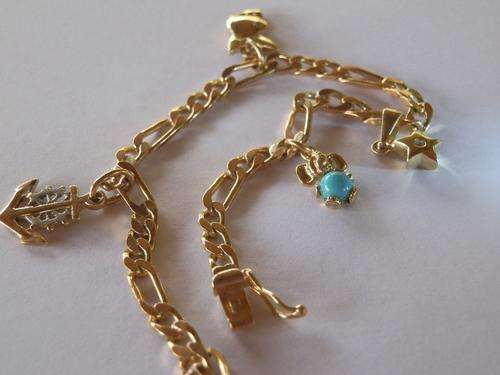 14ct Gold charm bracelet with 4 charms