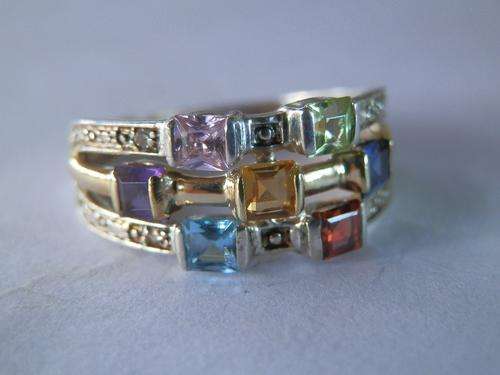 Silver and gold multi-gem ring with four small diamonds