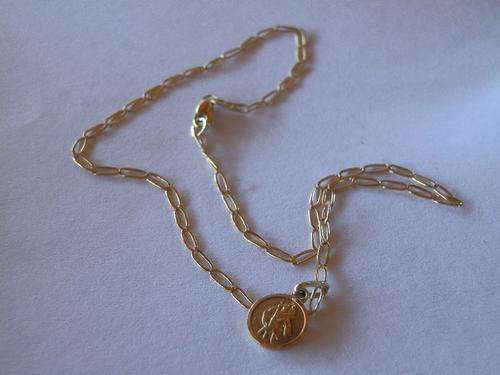 9ct Gold ankle chain and a charm - shipping R35 insured